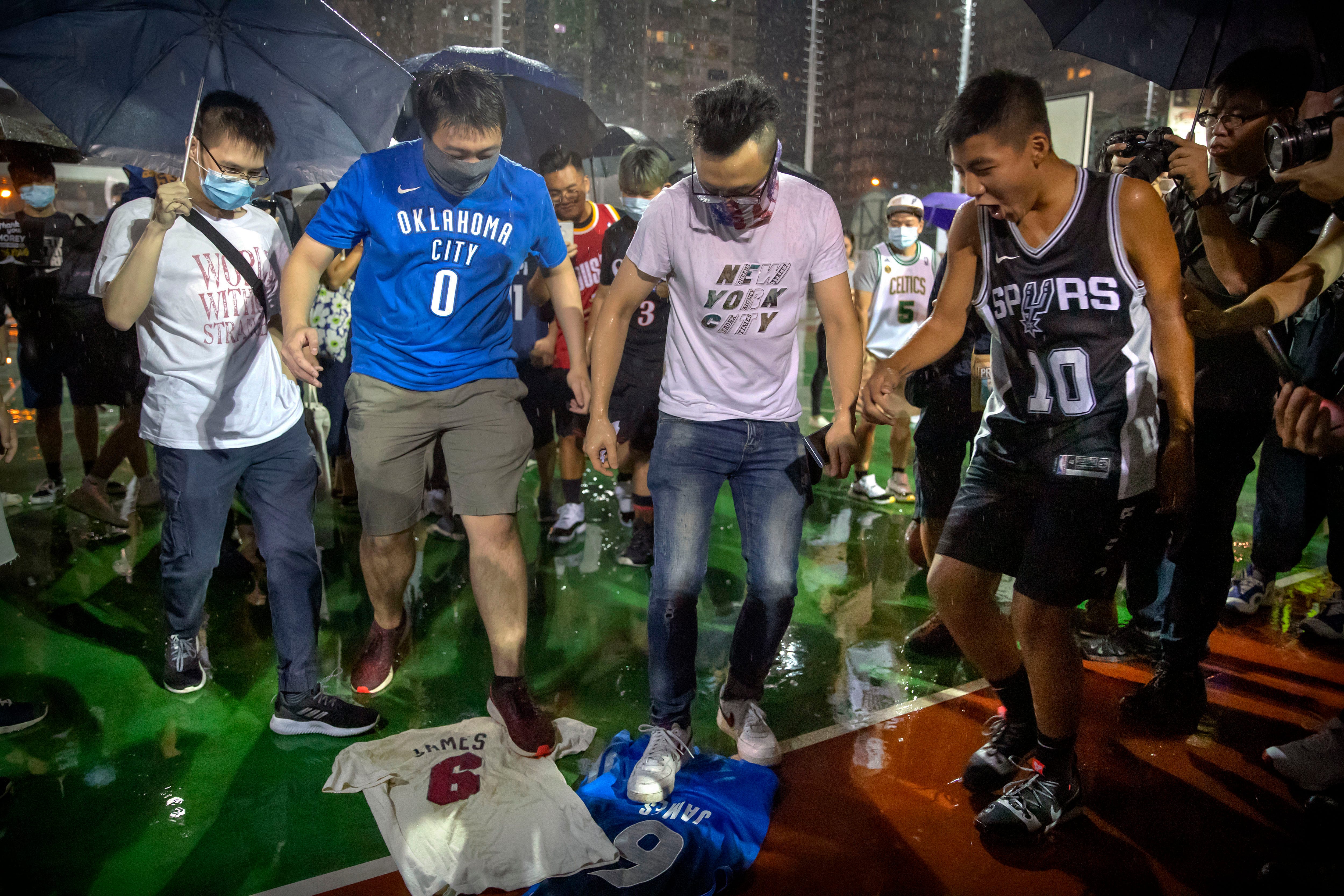 Hong Kong protesters burn jersey